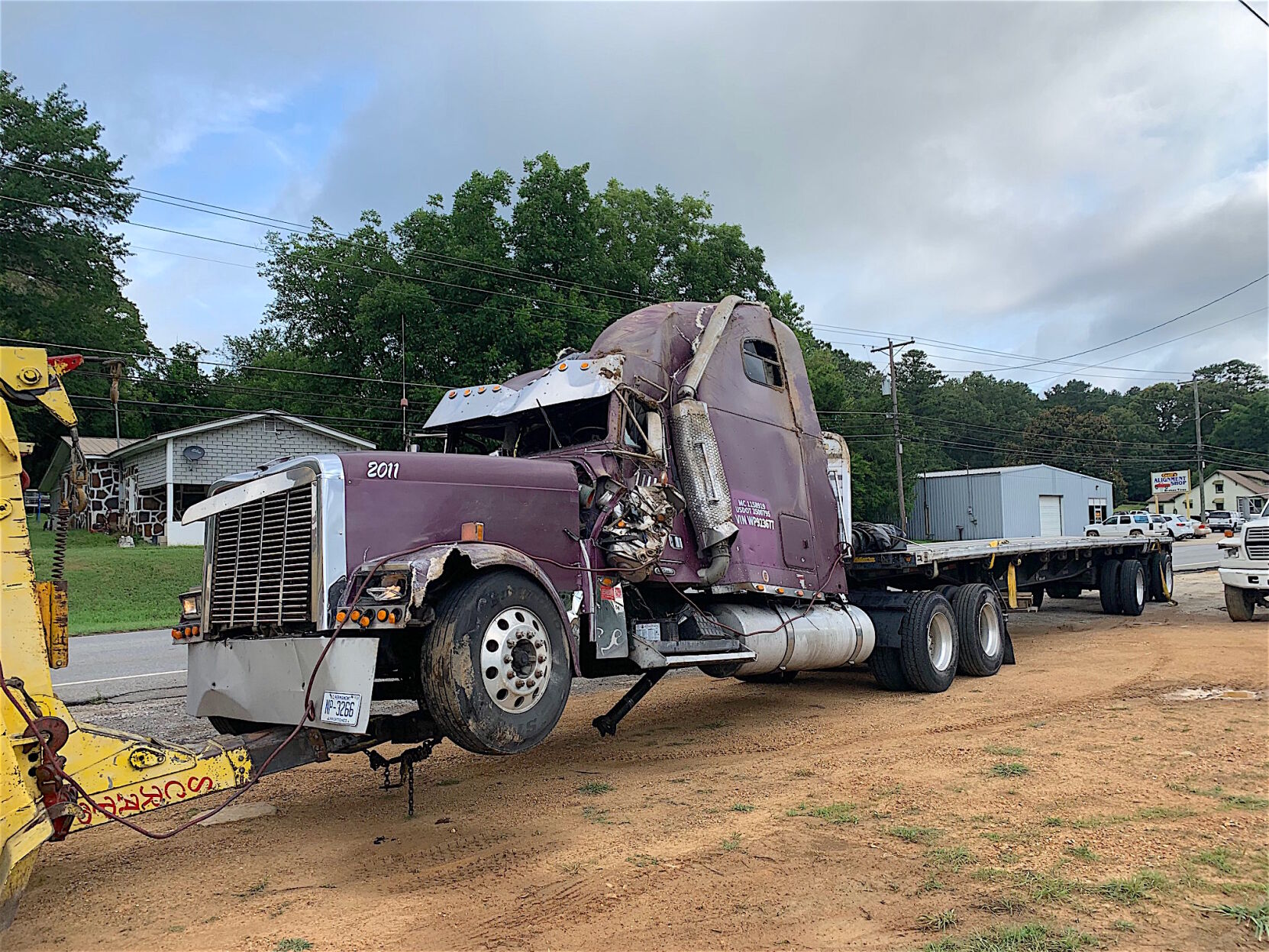 Another truck collides with Joe's Truck Stop, spilling lumber